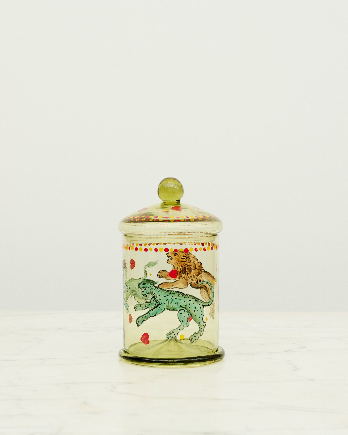 Green glass bonbonniere with hand painted animals.
