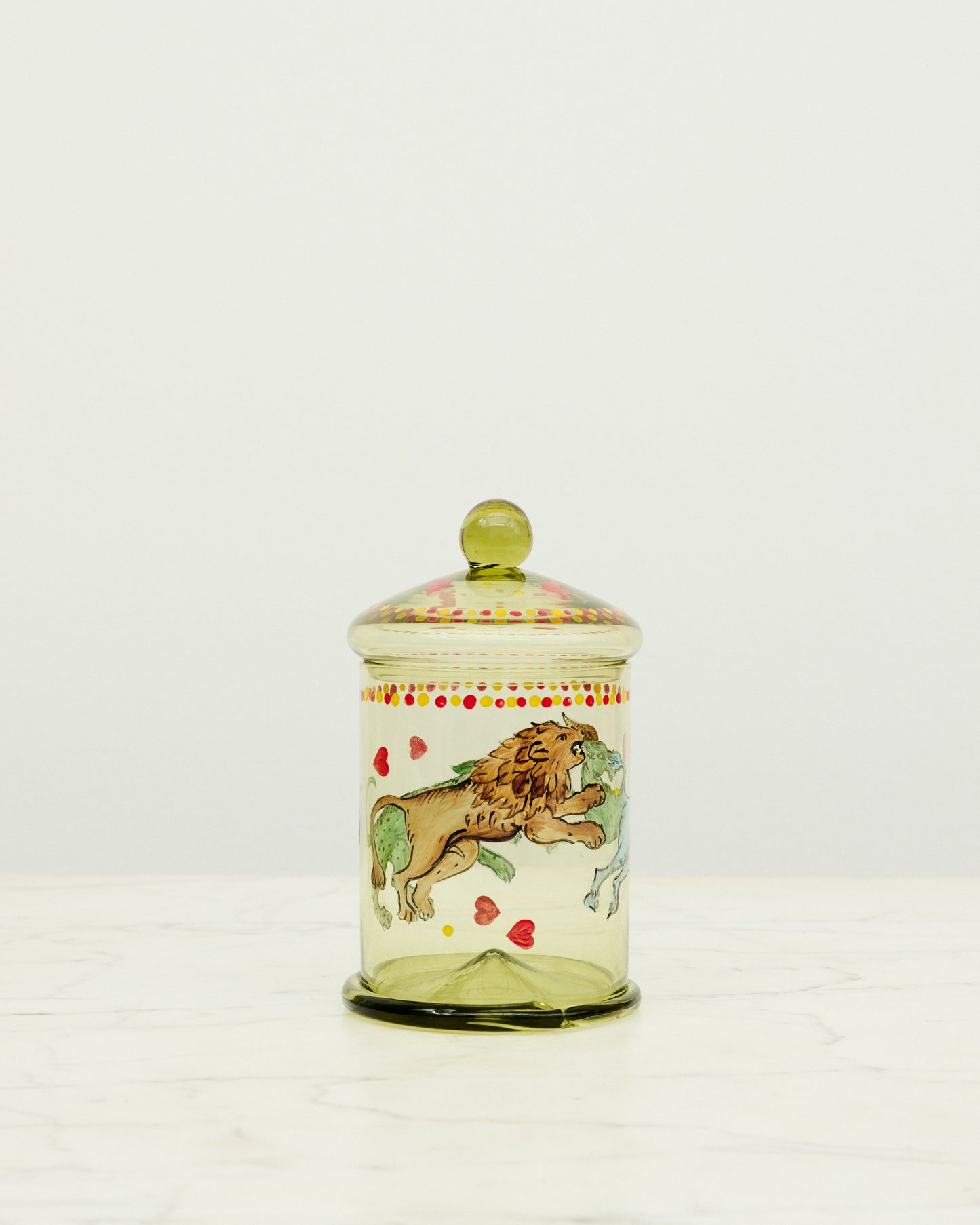 Green glass bonbonniere with hand painted animals.