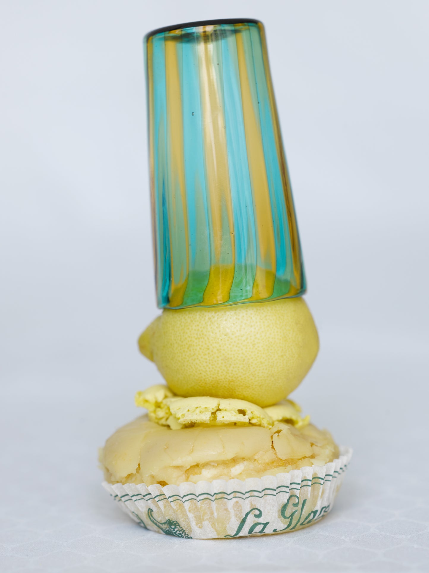 Small striped handmade Murano glass in blue and yellow with citrus and macaron.