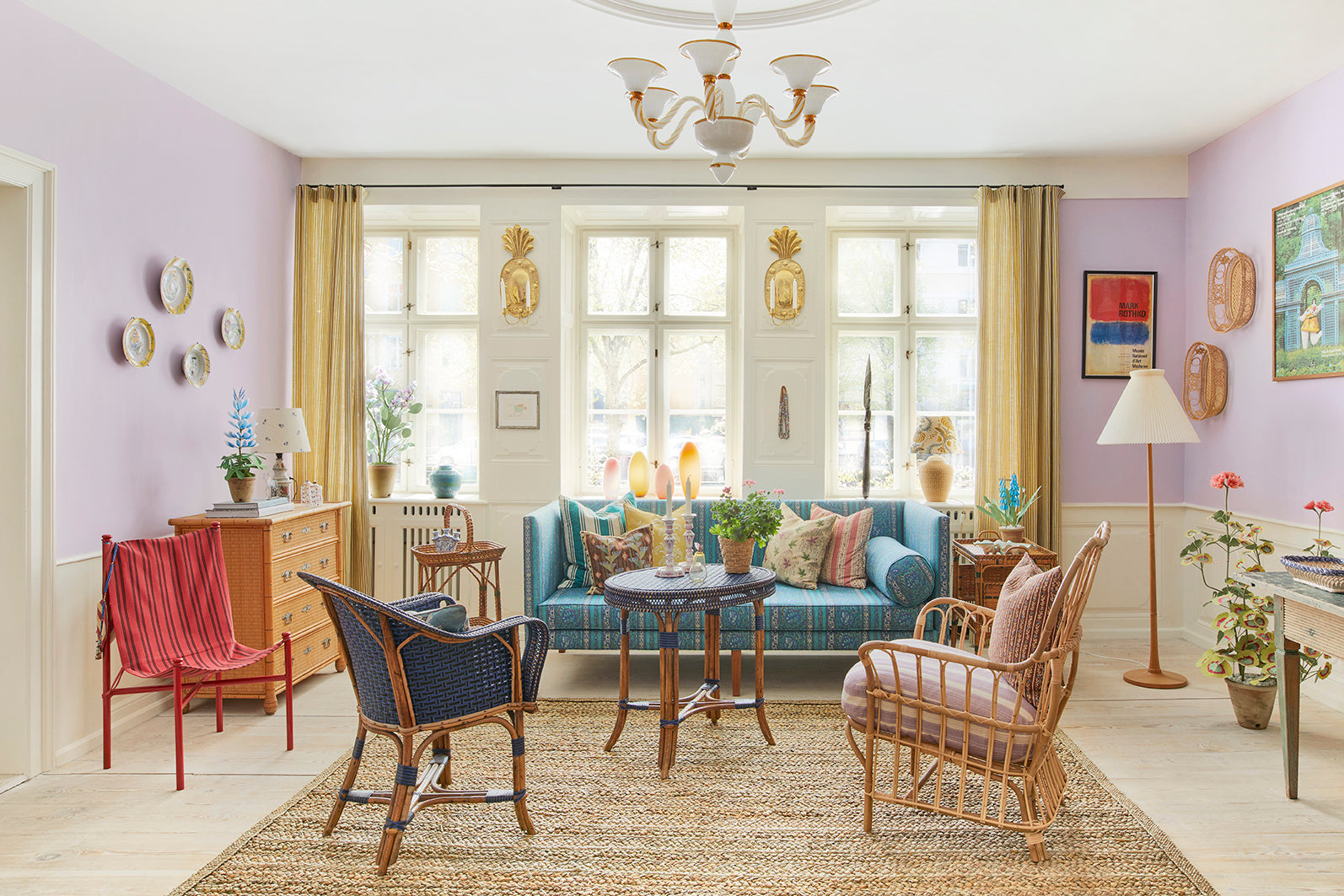 Short Murano glass chandelier in opal and amber hanging from ceiling in The Apartment.