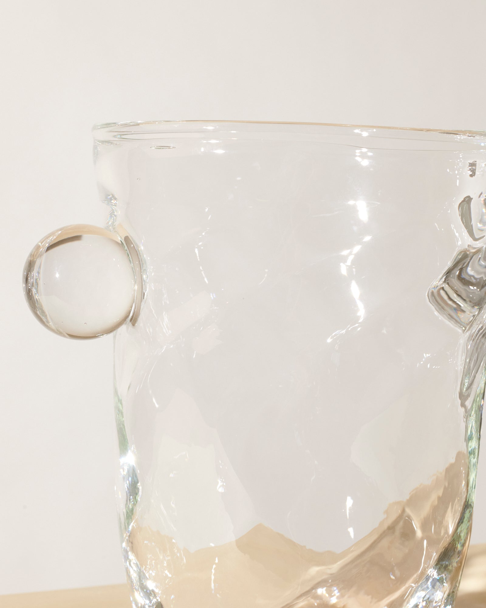 Akua Objects Glassware. Mouth blown and handmade Bohemian Glassware. Made in Bohemia. The Oliver vase is named after friend and muse of Akua Objects, Oliver Fussing. Different shapes meet and create a sculptural silhouette. The Oliver vase could have been born during the art deco period and act as a contemporary piece in Akua Object’s poetic universe. It takes four people to create each Oliver vase.