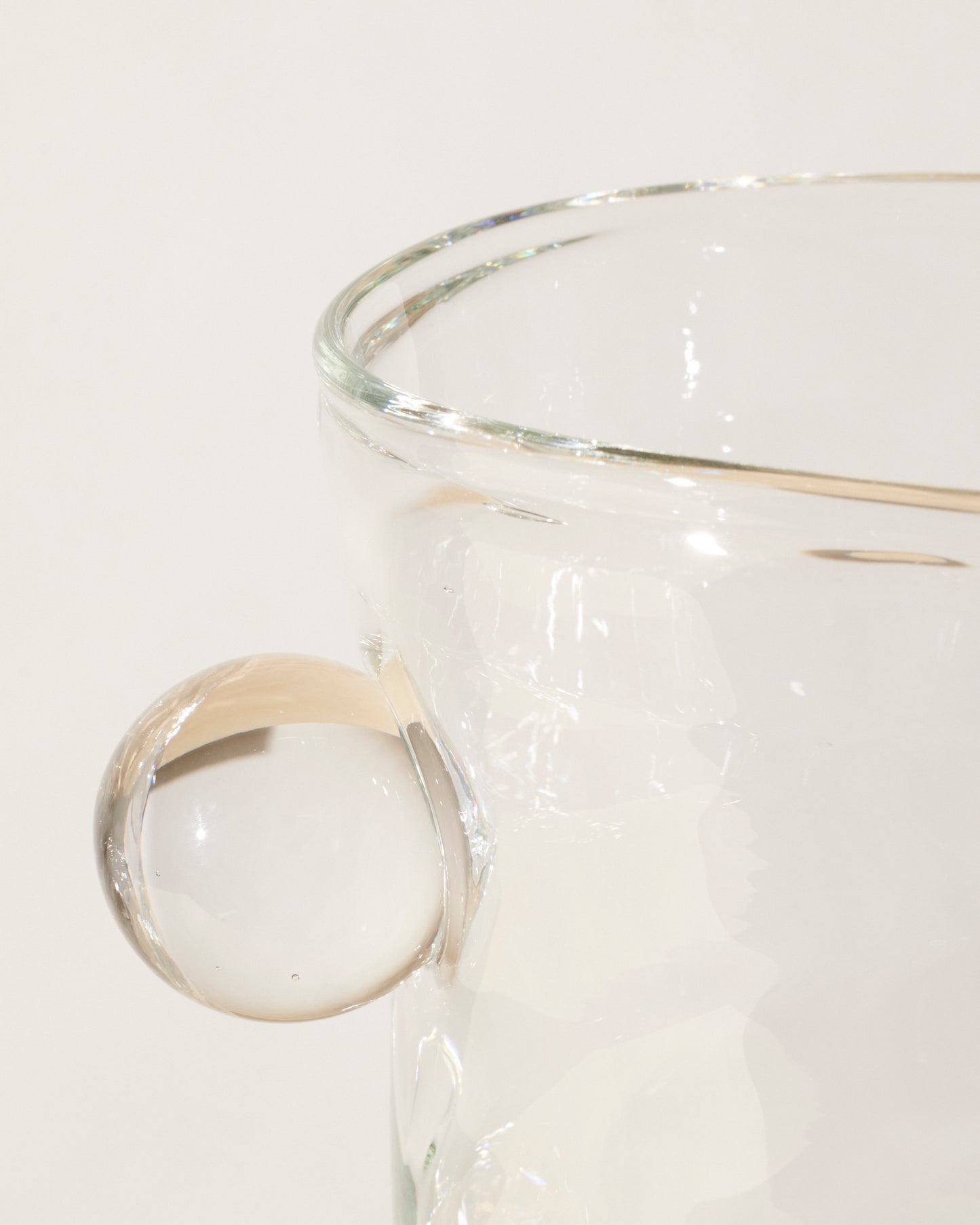 Akua Objects Glassware. Mouth blown and handmade Bohemian Glassware. Made in Bohemia. The Oliver vase is named after friend and muse of Akua Objects, Oliver Fussing. Different shapes meet and create a sculptural silhouette. The Oliver vase could have been born during the art deco period and act as a contemporary piece in Akua Object’s poetic universe. It takes four people to create each Oliver vase.