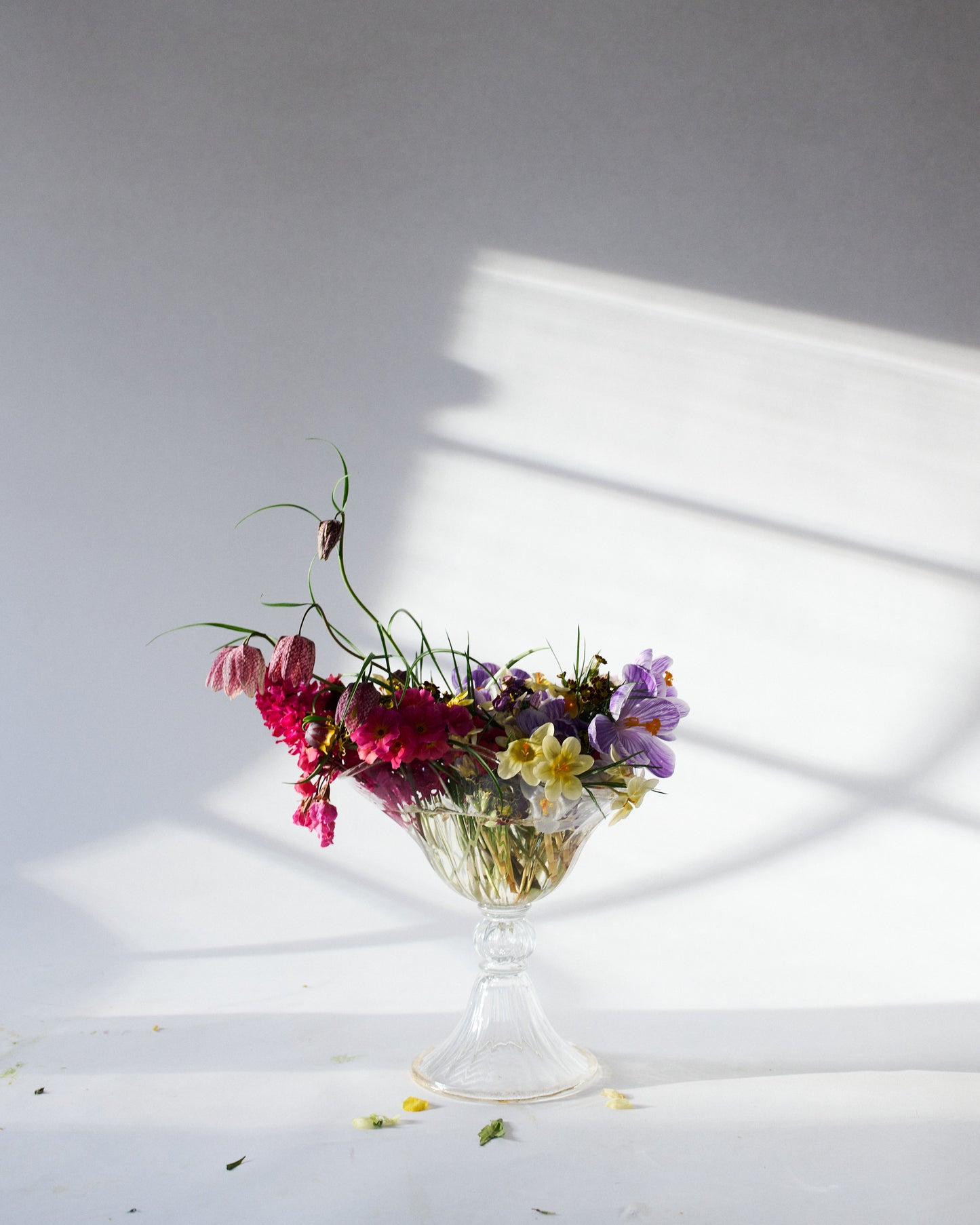 Large mouth blown clear Murano vase with flowers.