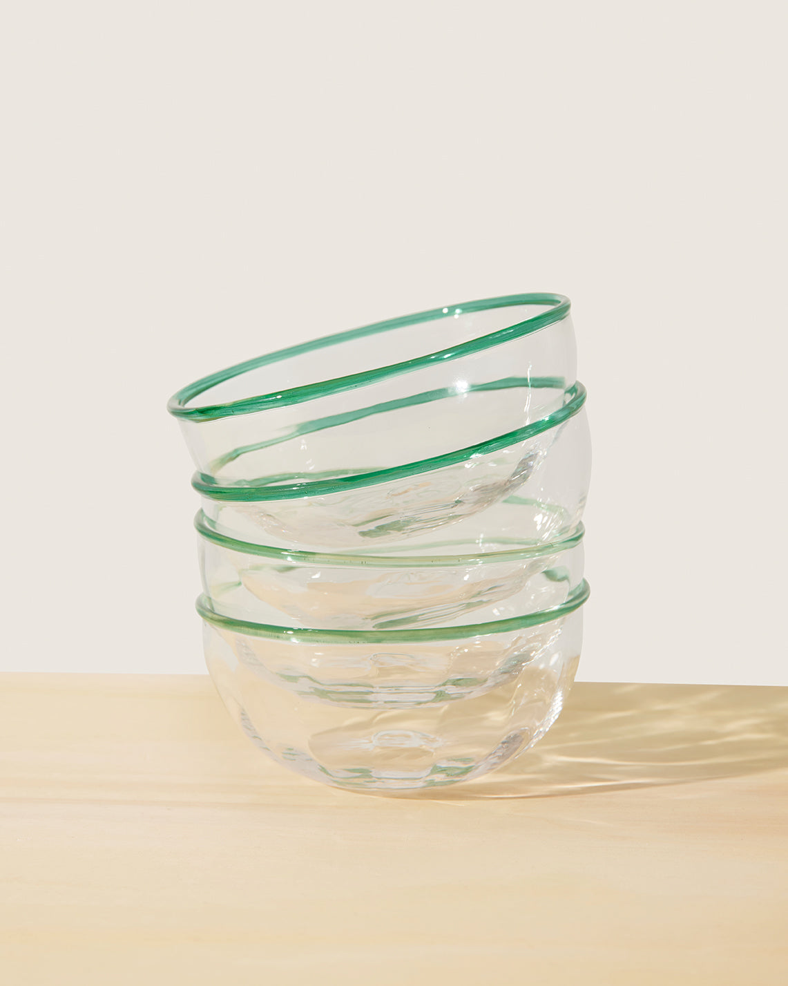Akua Objects Glassware. Mouth blown and handmade Bohemian Glassware. Made in Bohemia. The Peter collection is a dedication to Annika’s grandfather, who made a great effort of gathering his children and grandchildren around an atmospheric dinner table. Glassware with a rim has always been present in the home of Peter’s and is a timeless classic that will be found in homes for many generations to come.