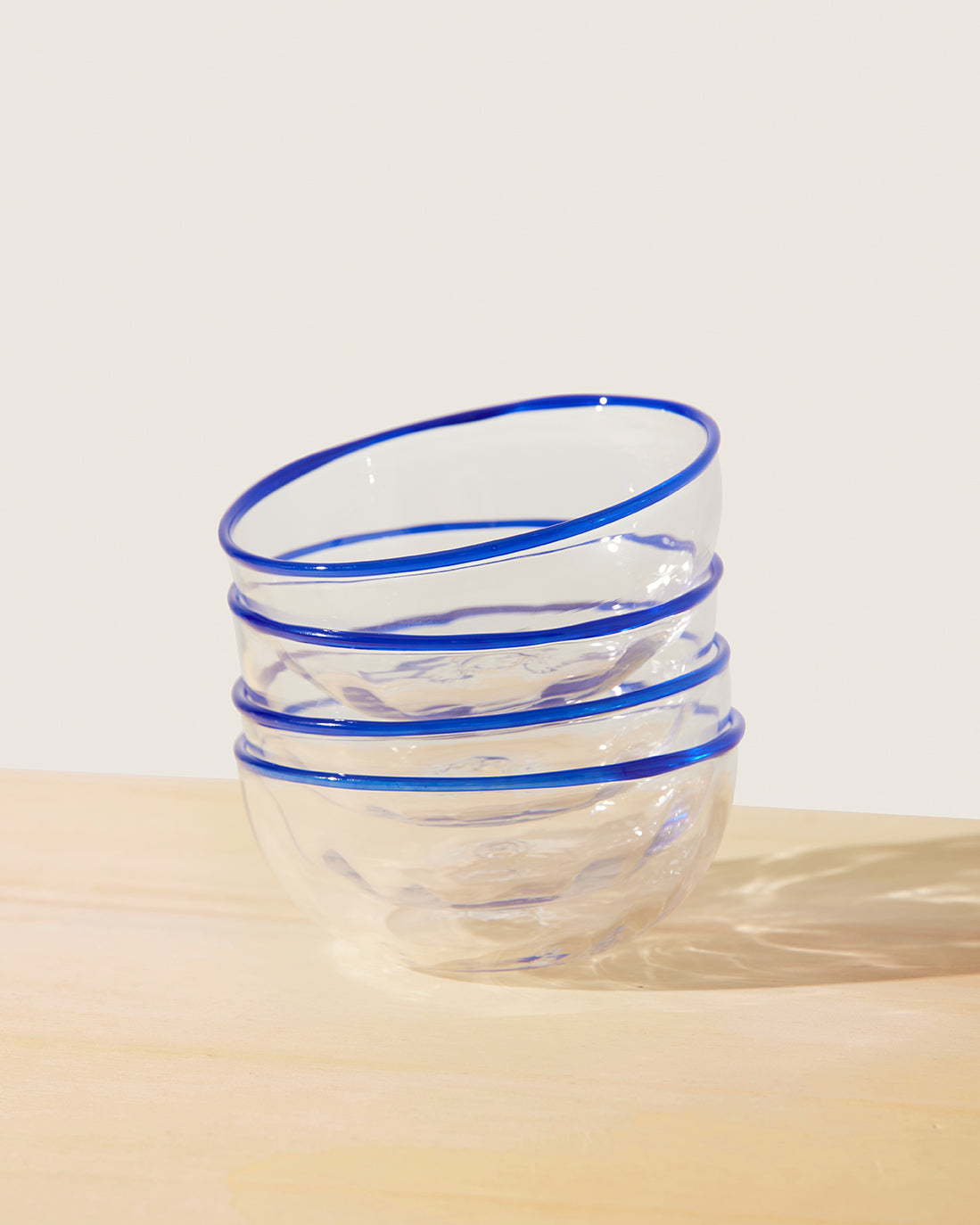 Akua Objects Glassware. Mouth blown and handmade Bohemian Glassware. Made in Bohemia. The Peter collection is a dedication to Annika’s grandfather, who made a great effort of gathering his children and grandchildren around an atmospheric dinner table. Glassware with a rim has always been present in the home of Peter’s and is a timeless classic that will be found in homes for many generations to come.