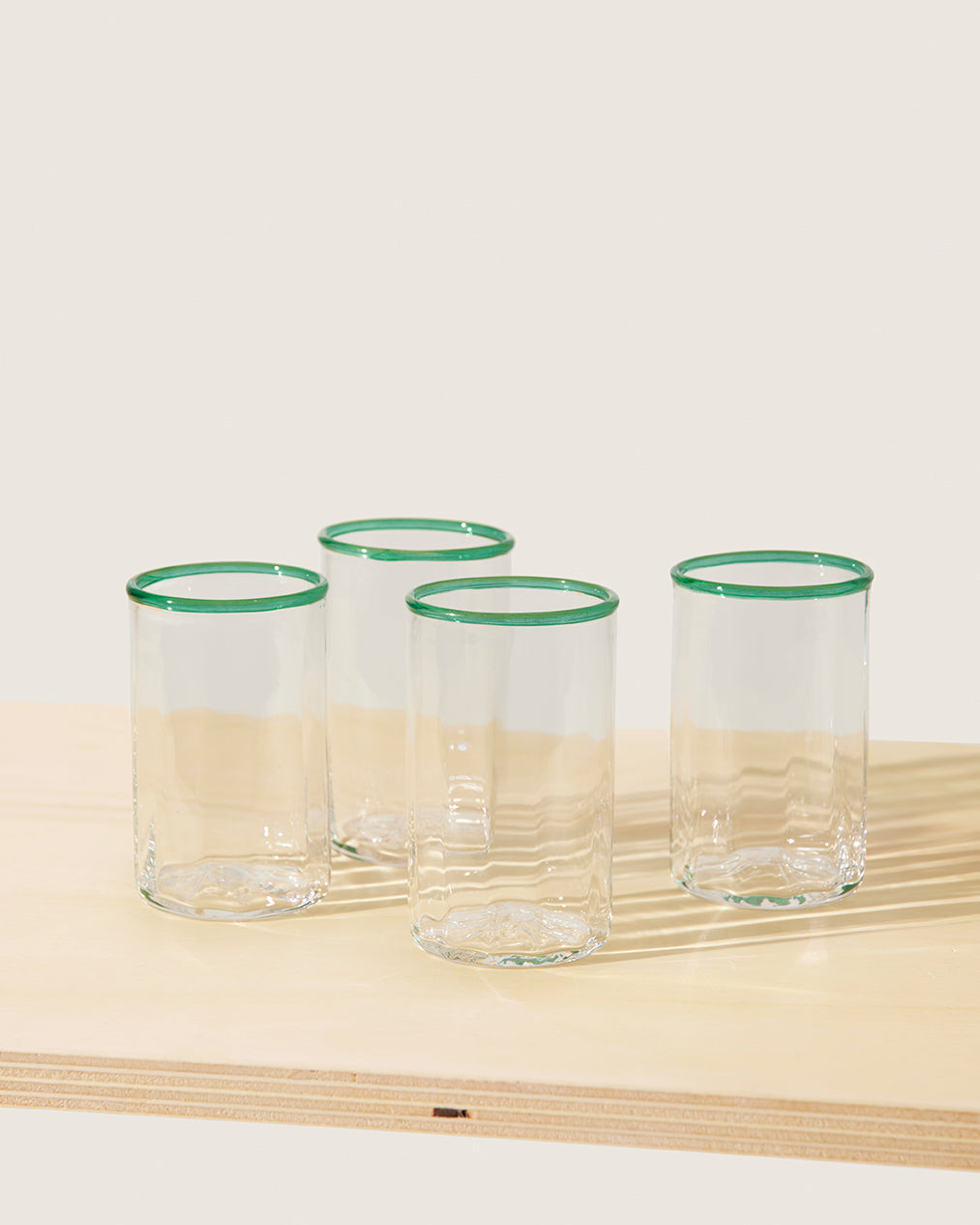 Akua Objects Glassware. Mouth blown and handmade Bohemian Glassware. Made in Bohemia. The Peter collection is a dedication to Annika’s grandfather, who made a great effort of gathering his children and grandchildren around an atmospheric dinner table. Glassware with a rim has always been present in the home of Peter’s and is a timeless classic that will be found in homes for many generations to come.