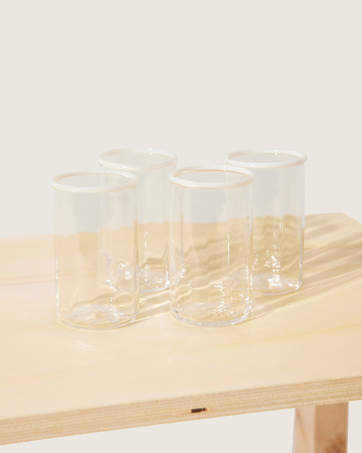 Akua Objects Glassware. Mouth blown and handmade Bohemian Glassware. Made in Bohemia. The Peter collection is a dedication to Annika’s grandfather, who made a great effort of gathering his children and grandchildren around an atmospheric dinner table. Glassware with a rim has always been present in the home of Peter’s and is a timeless classic that will be found in homes for many generations to come.