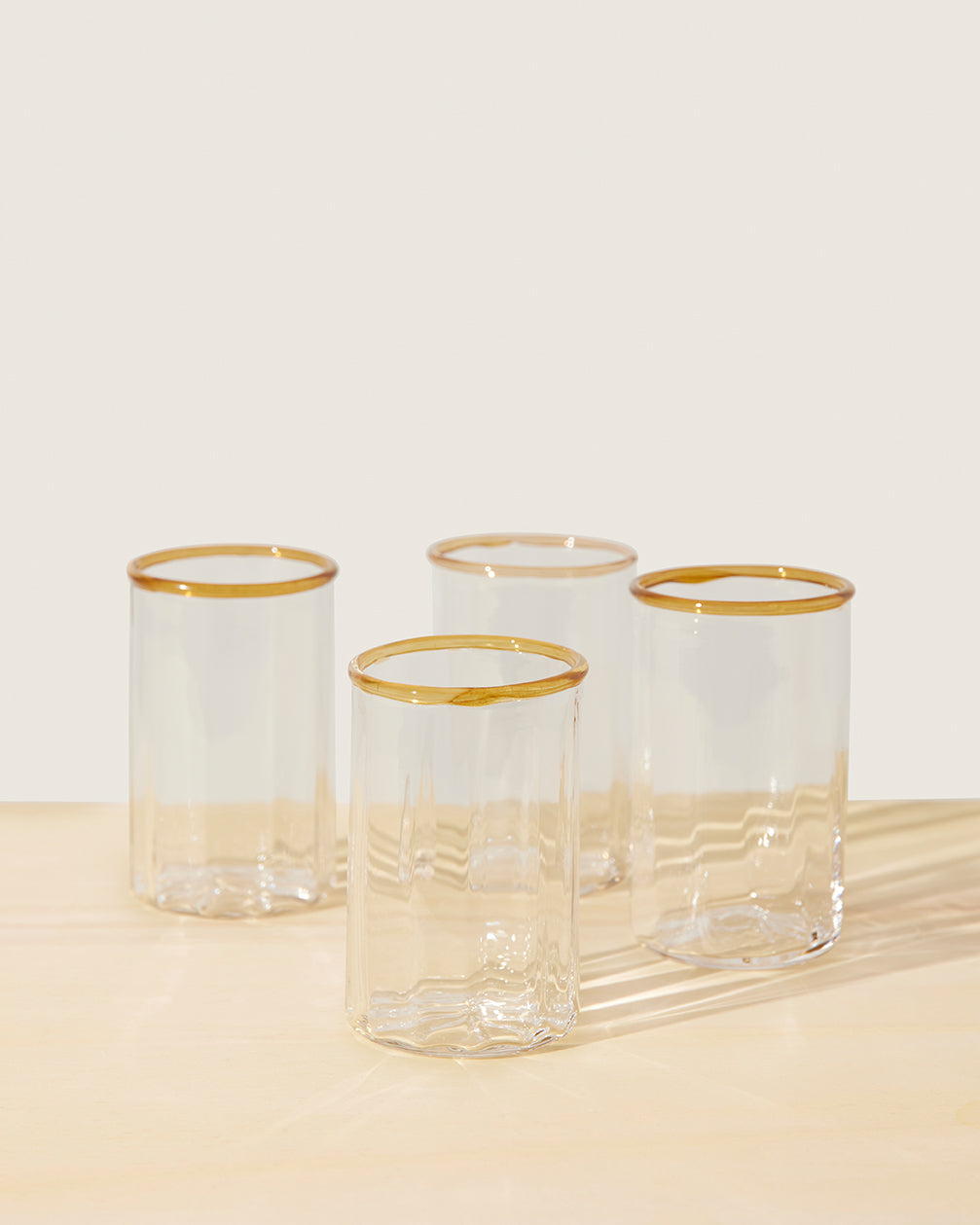 Akua Objects Glassware. Mouth blown and handmade Bohemian Glassware. Made in Bohemia. The Peter collection is a dedication to Annika’s grandfather, who made a great effort of gathering his children and grandchildren around an atmospheric dinner table. Glassware with a rim has always been present in the home of Peter’s and is a timeless classic that will be found in homes for many generations to come.