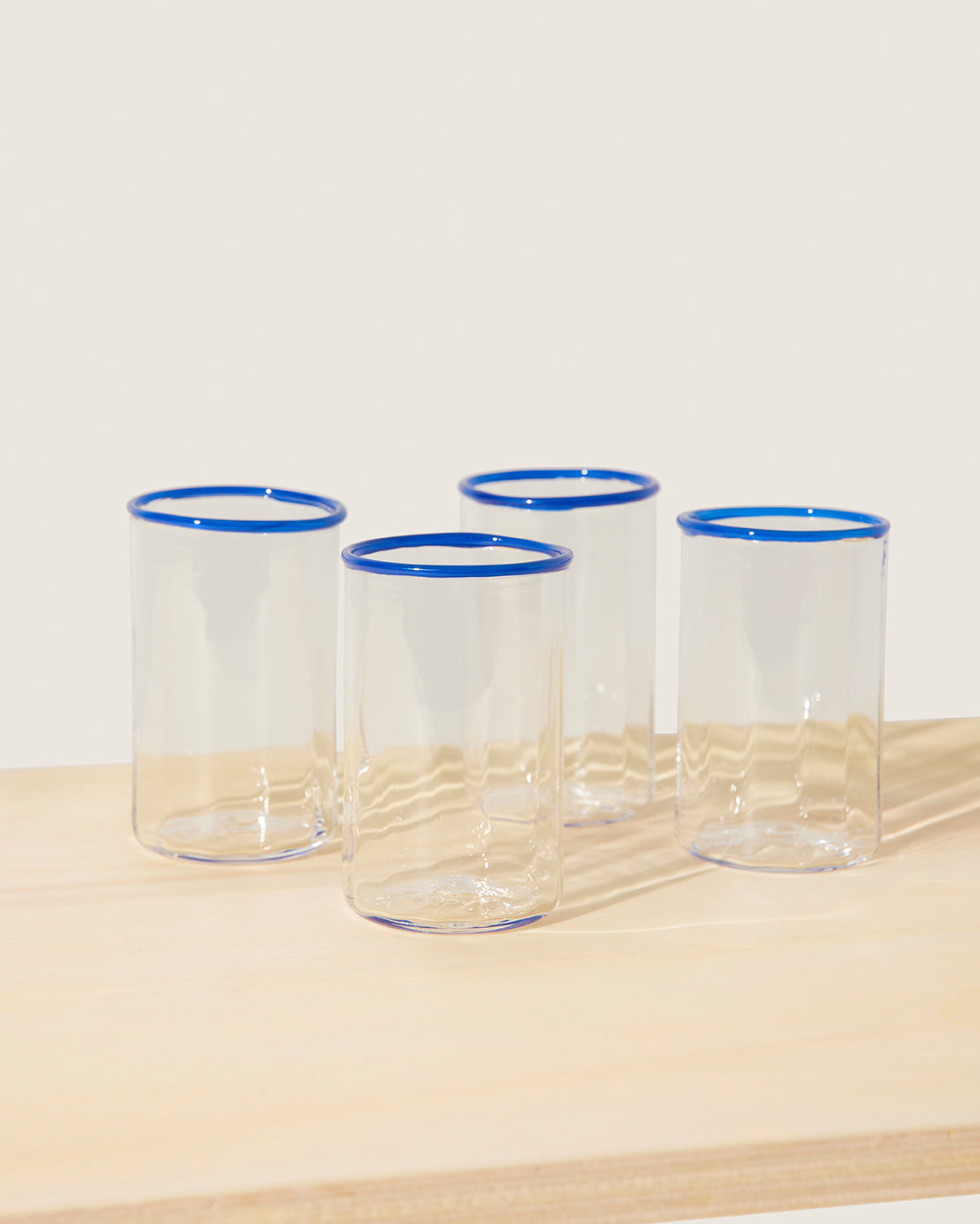 Akua Objects Glassware. Mouth blown and handmade Bohemian Glassware. Made in Bohemia. The Peter collection is a dedication to Annika’s grandfather, who made a great effort of gathering his children and grandchildren around an atmospheric dinner table. Glassware with a rim has always been present in the home of Peter’s and is a timeless classic that will be found in homes for many generations to come.