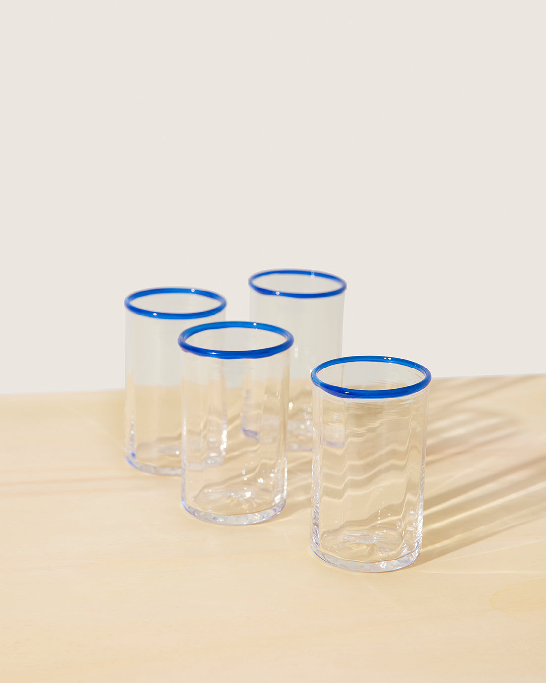 Akua Objects Glassware. Mouth blown and handmade Bohemian Glassware. Made in Bohemia. The Peter collection is a dedication to Annika’s grandfather, who made a great effort of gathering his children and grandchildren around an atmospheric dinner table. Glassware with a rim has always been present in the home of Peter’s and is a timeless classic that will be found in homes for many generations to come.