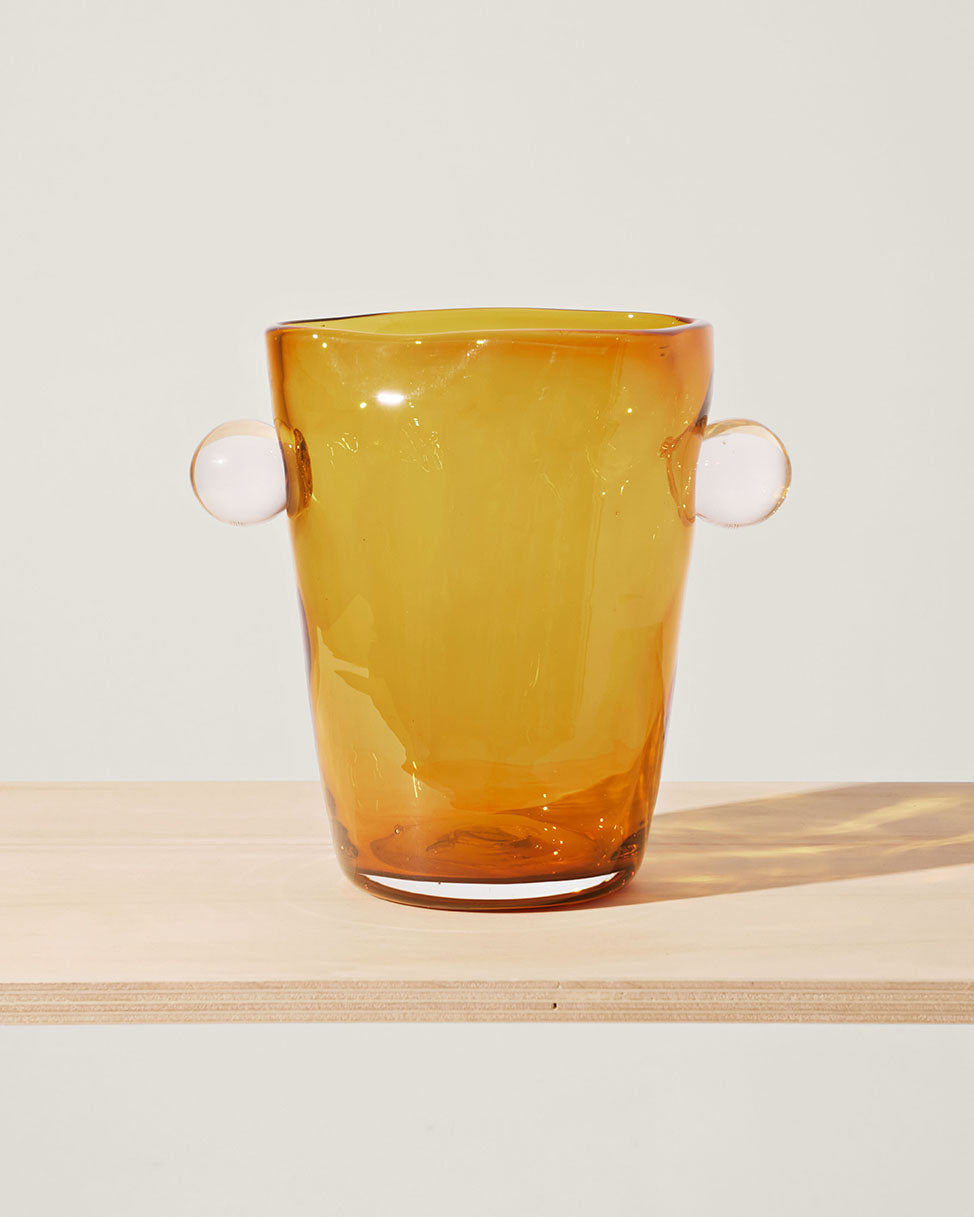 Akua Objects Glassware. Mouth blown and handmade Bohemian Glassware. Made in Bohemia. The Oliver vase is named after friend and muse of Akua Objects, Oliver Fussing. Different shapes meet and create a sculptural silhouette. The Oliver vase could have been born during the art deco period and act as a contemporary piece in Akua Object’s poetic universe. It takes four people to create each Oliver vase.