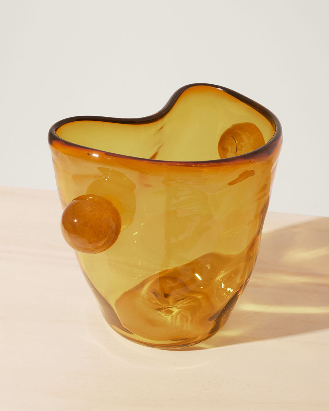 Akua Objects Glassware. Mouth blown and handmade Bohemian Glassware. Made in Bohemia. The Oliver vase is named after friend and muse of Akua Objects, Oliver Fussing. Different shapes meet and create a sculptural silhouette. The Oliver vase could have been born during the art deco period and act as a contemporary piece in Akua Object’s poetic universe. It takes four people to create each Oliver vase.