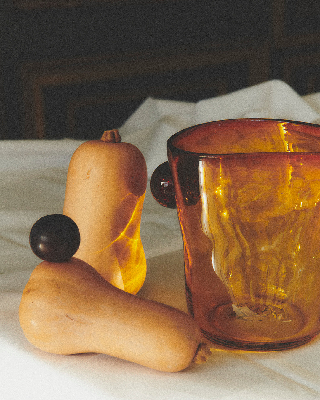 Akua Objects Glassware. Mouth blown and handmade Bohemian Glassware. Made in Bohemia. The Oliver vase is named after friend and muse of Akua Objects, Oliver Fussing. Different shapes meet and create a sculptural silhouette. The Oliver vase could have been born during the art deco period and act as a contemporary piece in Akua Object’s poetic universe. It takes four people to create each Oliver vase.