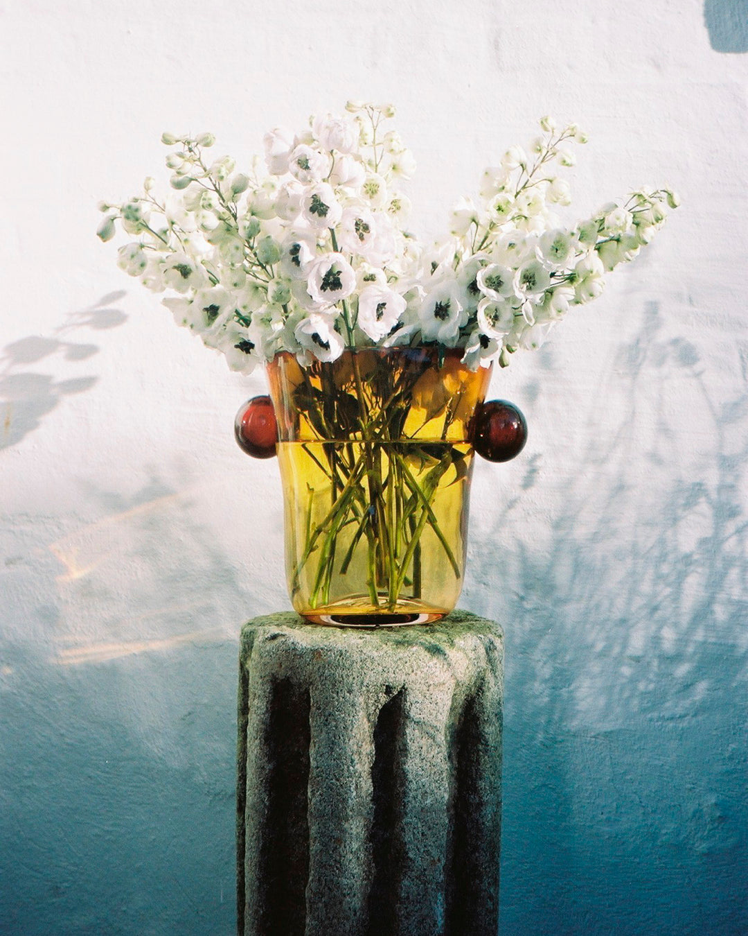 Akua Objects Glassware. Mouth blown and handmade Bohemian Glassware. Made in Bohemia. The Oliver vase is named after friend and muse of Akua Objects, Oliver Fussing. Different shapes meet and create a sculptural silhouette. The Oliver vase could have been born during the art deco period and act as a contemporary piece in Akua Object’s poetic universe. It takes four people to create each Oliver vase.