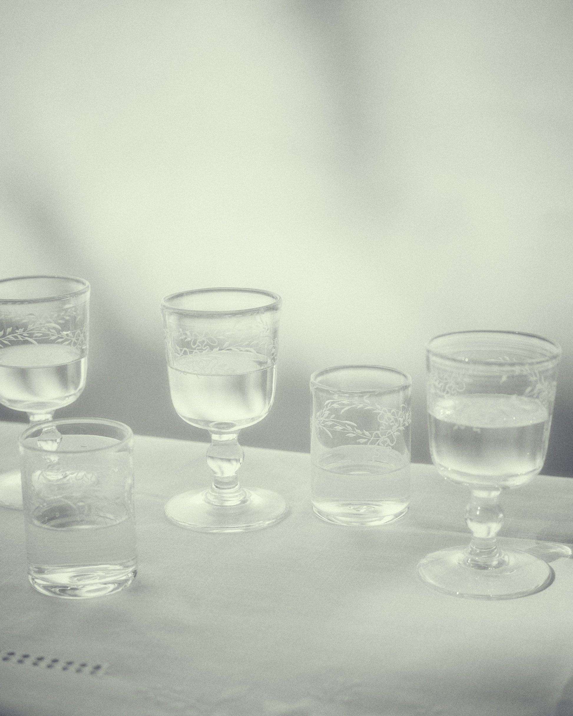 Akua Objects Glassware. Mouth blown and handmade Bohemian Glassware. Made in Bohemia. Add poetry to your table with Barbro water glasses. These contemporary interpreted glasses have been mouth blown with patterns added afterwards, patiently engraved by a master’s hand.