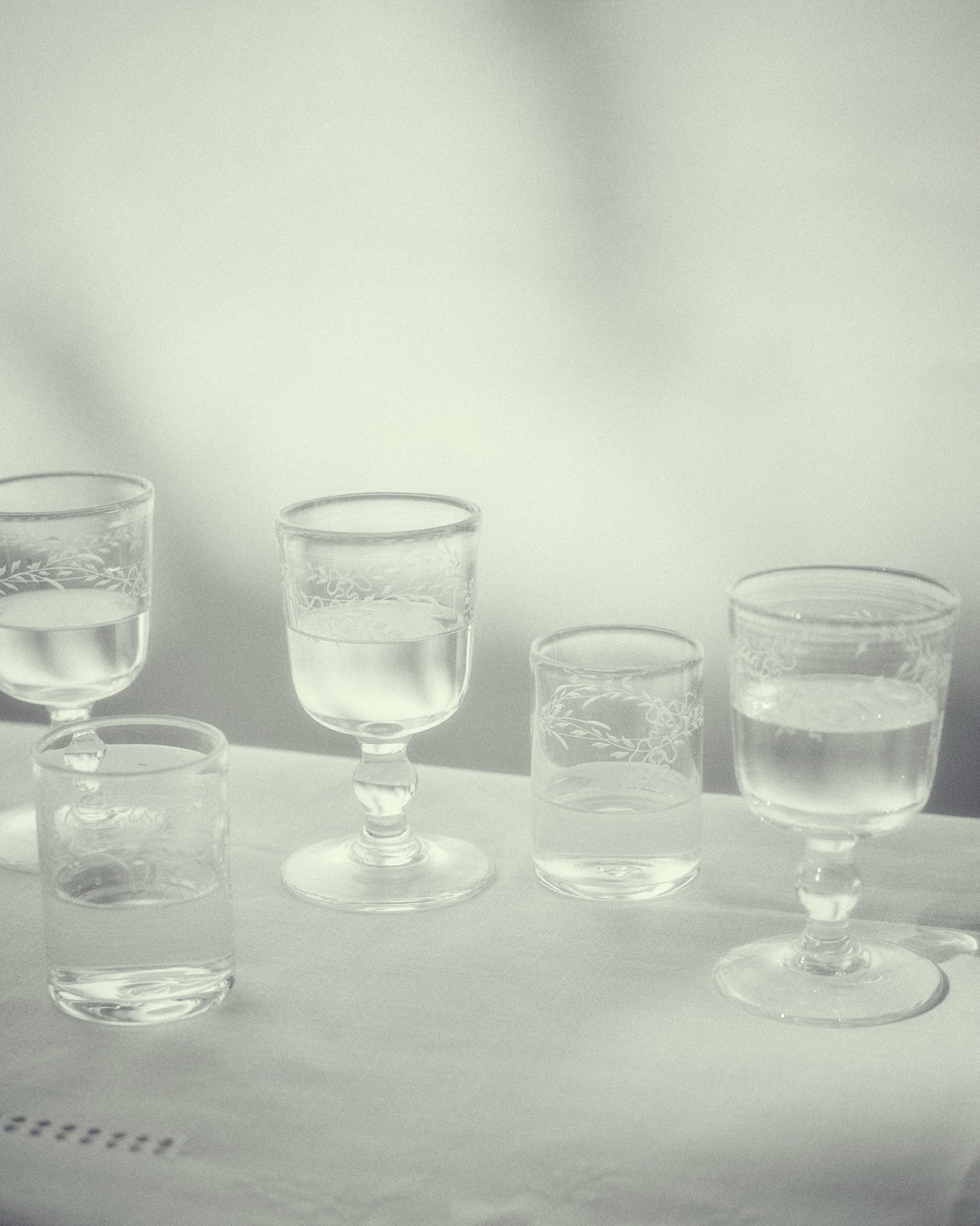 Akua Objects Glassware. Mouth blown and handmade Bohemian Glassware. Made in Bohemia. Add poetry to your table with Barbro water glasses. These contemporary interpreted glasses have been mouth blown with patterns added afterwards, patiently engraved by a master’s hand.
