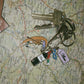 Keychain with colorful enamel charms of a gondola, wine bottle & glass, venetian mask, and "Akua" tag.