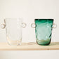 Akua Objects Glassware. Mouth blown and handmade Bohemian Glassware. Made in Bohemia. The Oliver vase is named after friend and muse of Akua Objects, Oliver Fussing. Different shapes meet and create a sculptural silhouette. The Oliver vase could have been born during the art deco period and act as a contemporary piece in Akua Object’s poetic universe. It takes four people to create each Oliver vase.