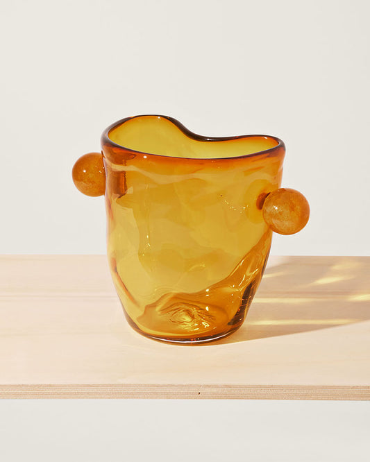 Akua Objects Glassware. Mouth blown and handmade Bohemian Glassware. Made in Bohemia. The Oliver vase is named after friend and muse of Akua Objects, Oliver Fussing. Different shapes meet and create a sculptural silhouette. The Oliver vase could have been born during the art deco period and act as a contemporary piece in Akua Object’s poetic universe. It takes four people to create each Oliver vase.