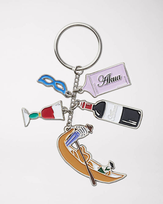 Keychain with colorful enamel charms of a gondola, wine bottle & glass, venetian mask, and "Akua" tag.