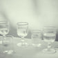 Akua Objects Glassware. Mouth blown and handmade Bohemian Glassware. Made in Bohemia. Add poetry to your table with Barbro water glasses. These contemporary interpreted glasses have been mouth blown with patterns added afterwards, patiently engraved by a master’s hand.