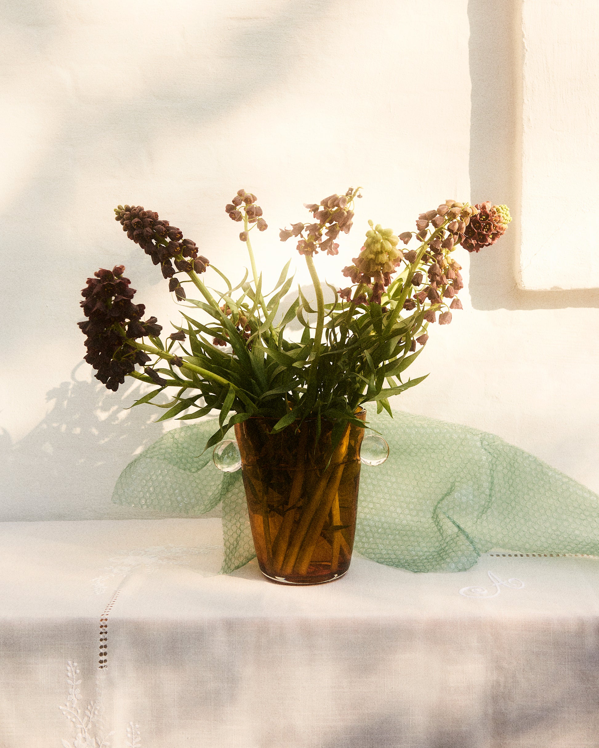 Akua Objects Glassware. Mouth blown and handmade Bohemian Glassware. Made in Bohemia. The Oliver vase is named after friend and muse of Akua Objects, Oliver Fussing. Different shapes meet and create a sculptural silhouette. The Oliver vase could have been born during the art deco period and act as a contemporary piece in Akua Object’s poetic universe. It takes four people to create each Oliver vase.